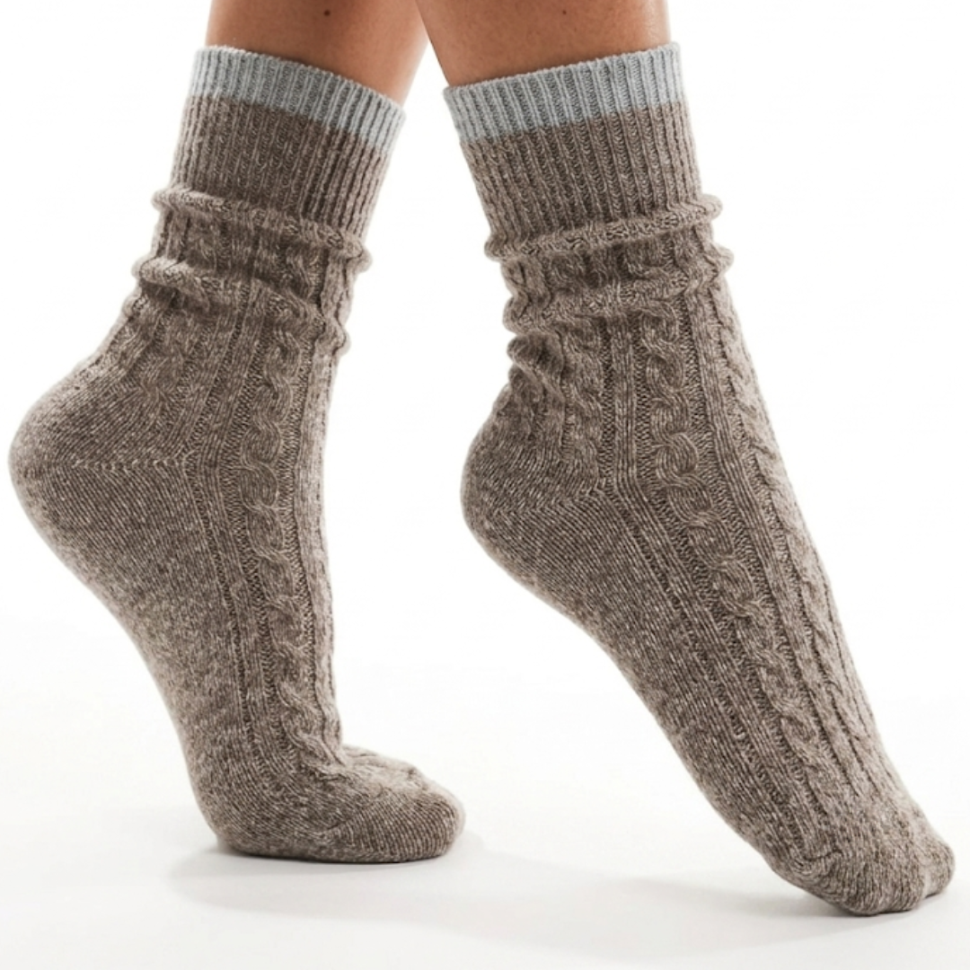 Merino wool warm socks in taupe cable knit, featuring a light blue cuff stripe. Worn on feet for cozy warmth.