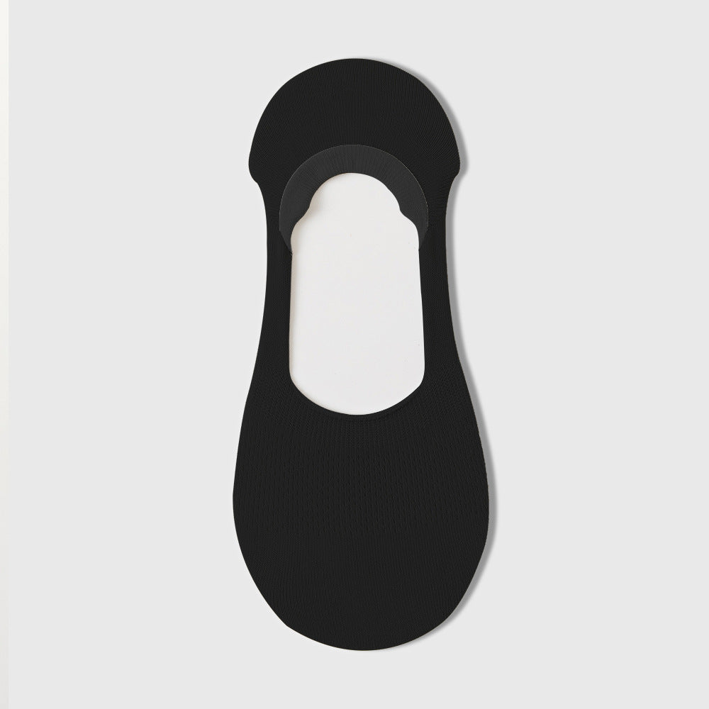 No show socks for loafers in black, a single invisible sock laid flat showing the heel-grip design.