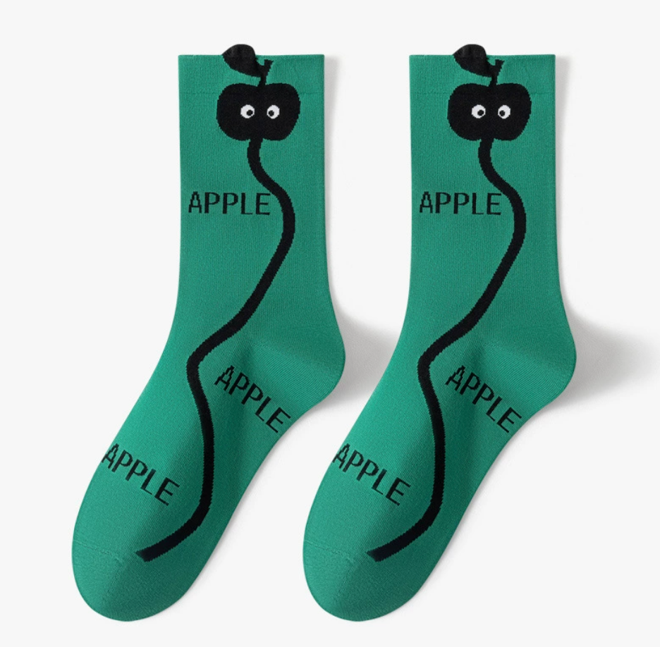 Novelty crew socks in green with an apple and snake graphic, featuring a quirky print. Shown as a flat-lay pair on a light surface.