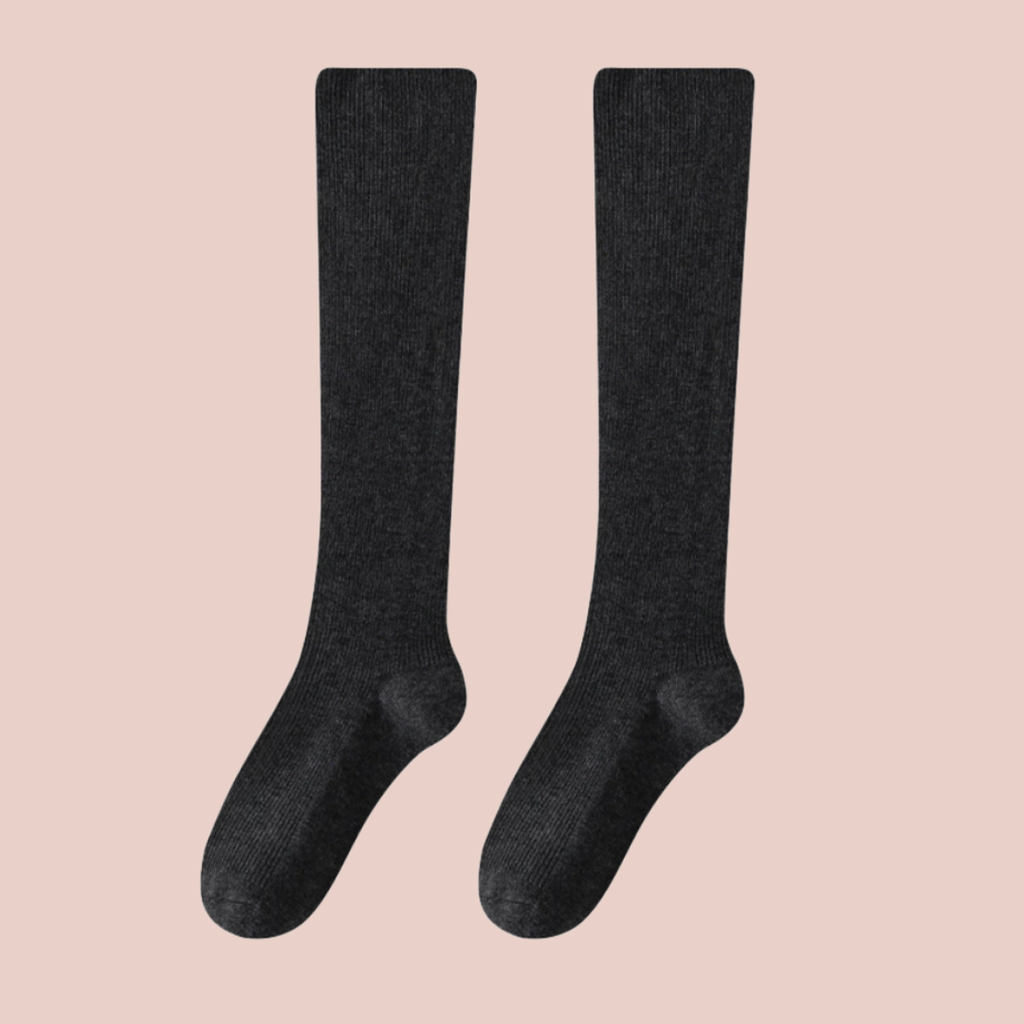 Over the calf wool dress socks in charcoal ribbed wool, featuring a tall over-the-calf leg. Shown as an upright flat-lay pair.