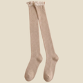 Over the knee boot socks in cream, featuring a ribbed knit with a long thigh-high leg. Shown as an upright pair on a neutral backdrop.