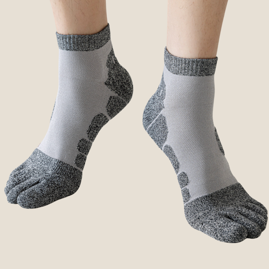 Running toe socks in grey and pale blue athletic knit, featuring cushioned pads and five-toe support. Worn on the feet.