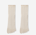 Separate toe socks in cream pointelle knit, featuring a scalloped ruffle cuff. Shown as a flat-lay pair on a light surface.