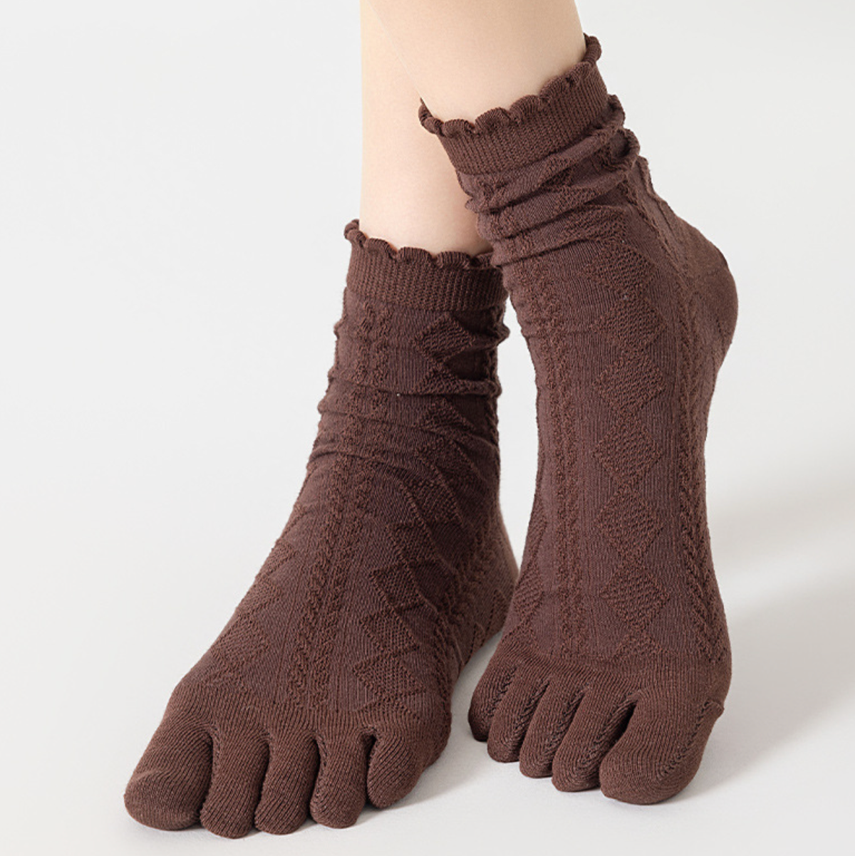 Separate toe socks in espresso brown pointelle knit, featuring a frilled ruffle cuff. Worn to show the individual toe design.