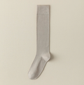 Sheer knee socks in cream mesh knit, featuring a fine ribbed texture. Shown as a single flat-lay on a neutral surface.