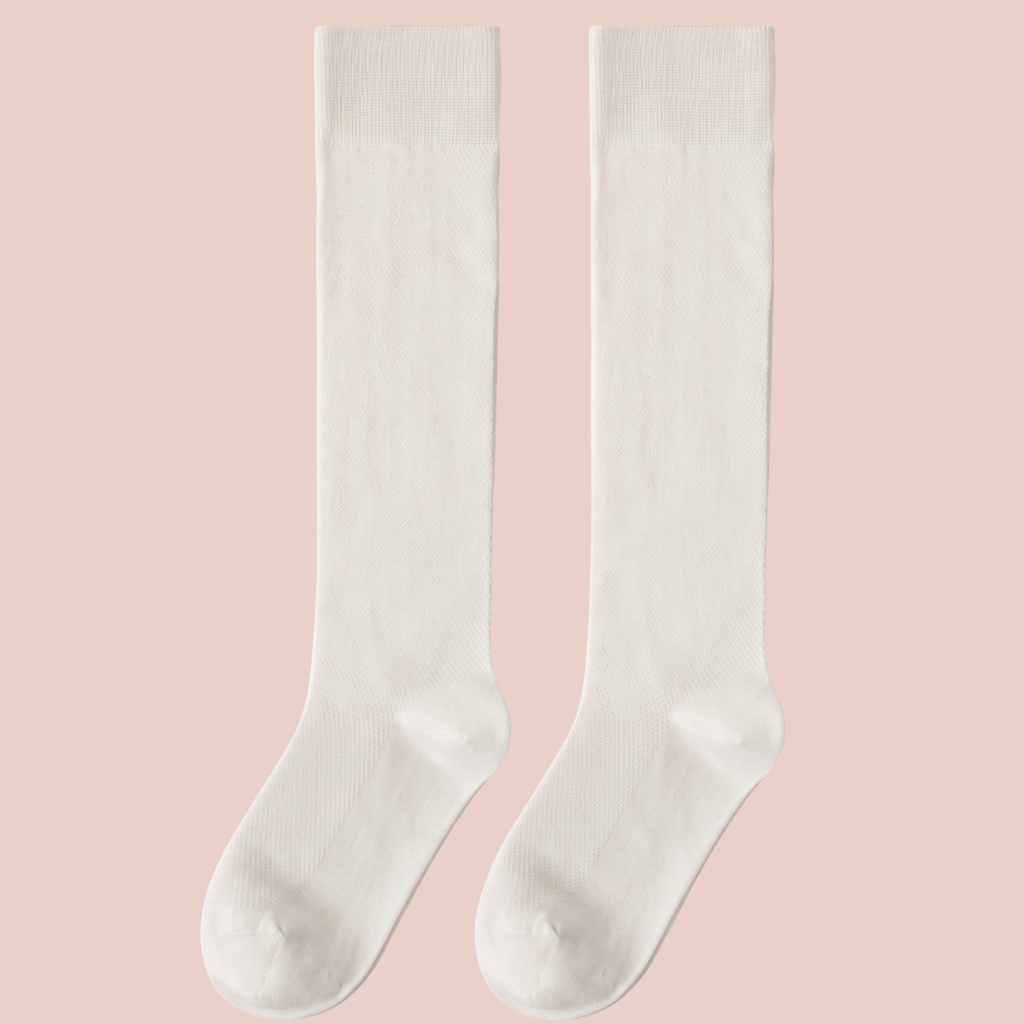 Sheer knee socks in ivory ribbed sheer knit, featuring a fine vertical rib. Shown as a flat-lay pair on a pink surface.