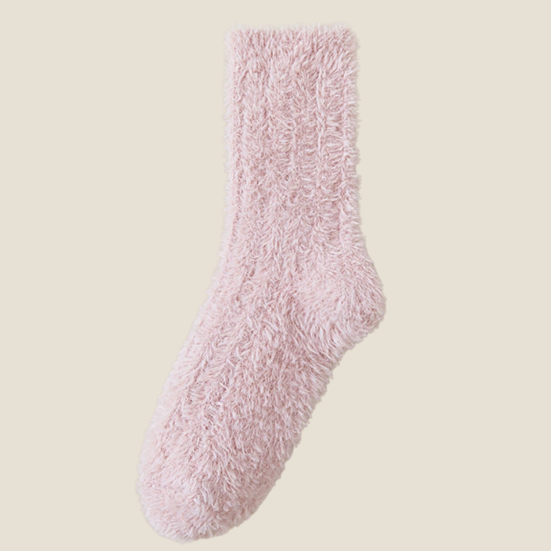 Socks for cold toes in rose pink fleece, featuring a plush cushioned toe. Laid flat against a soft neutral background.
