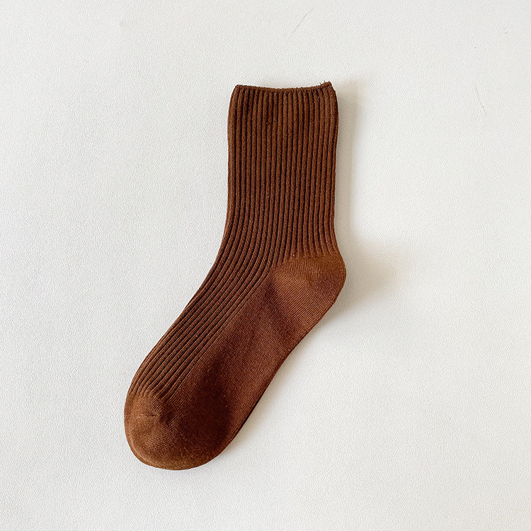 Socks for loafers women in coffee brown ribbed cotton, a single sock shown flat to highlight the ribbed knit.