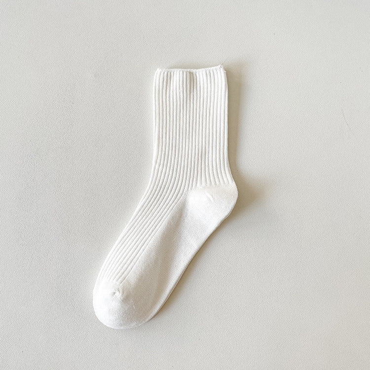 Socks for loafers women in white ribbed cotton, a single sock shown flat to display the vertical rib texture and cuff.