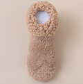 Soft slipper socks in tan, featuring a plush cushioned knit. Shown as a single flat-lay on a neutral backdrop.