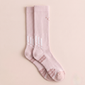 Sport knee socks in pale pink athletic knit, featuring a cushioned ribbed leg. Shown as an upright flat-lay pair.