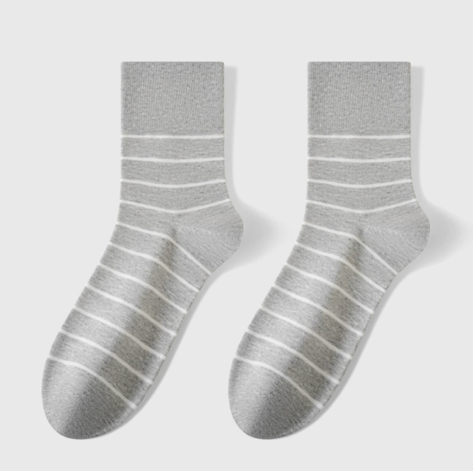 Stripe crew socks in grey with tonal stripes, featuring a ribbed knit. Shown as a flat-lay pair on a neutral surface.