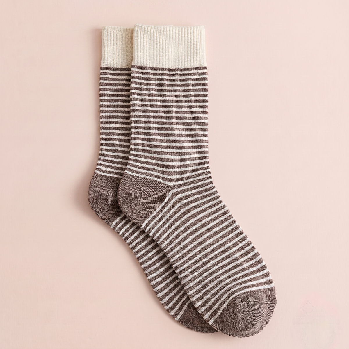 Striped wool dress socks in grey and white stripes with a brown heel, featuring a ribbed knit. Shown as a single flat-lay.