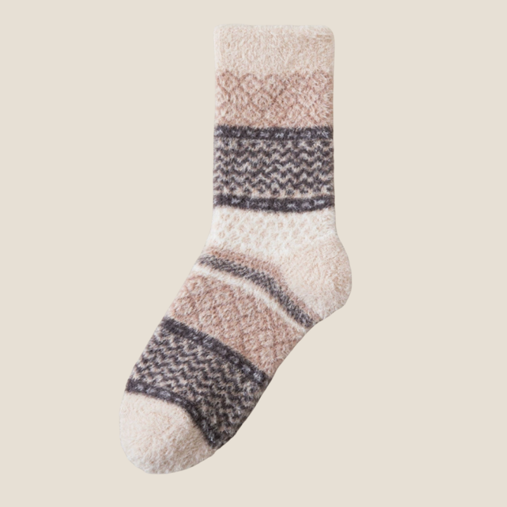 Super warm socks in cream fleece, featuring a grey Fair Isle stripe. Shown flat on a neutral surface.