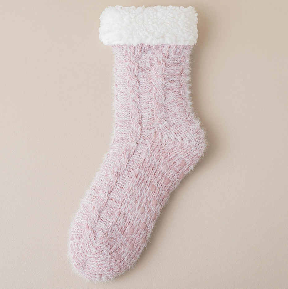 Thermal slipper socks in dusty pink, featuring a fuzzy thermal knit. Displayed flat on a light surface.