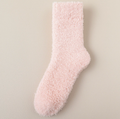 Thick socks for cold feet in dusty pink plush, featuring a thick cushioned body. Photographed from the side to show the cozy pile.