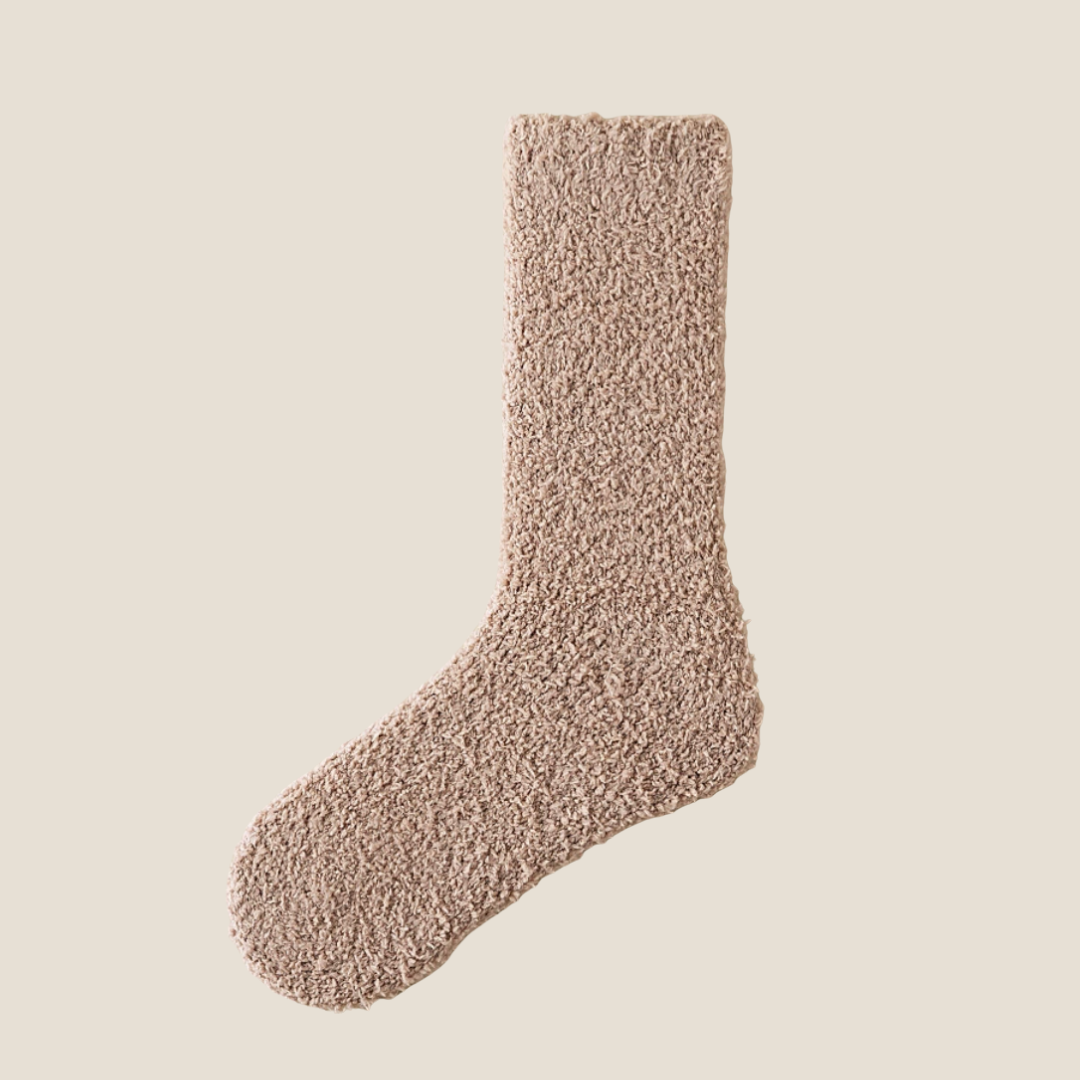 Thick warm socks in mocha tan plush, featuring a soft fuzzy weave. Displayed flat to show the warm pile.