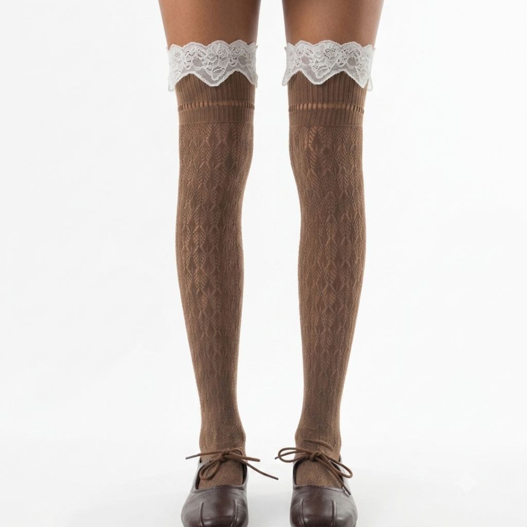 Thigh high cute lace stockings in brown pointelle knit with a white lace top, worn on the legs with brown shoes.