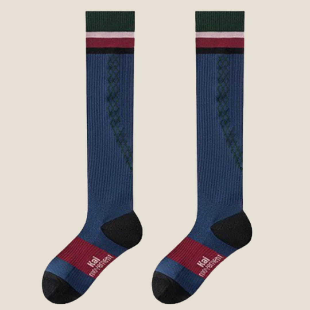 Volleyball knee high socks in navy blue with green and red stripes, featuring a cushioned athletic knit. Shown as a flat-lay pair.