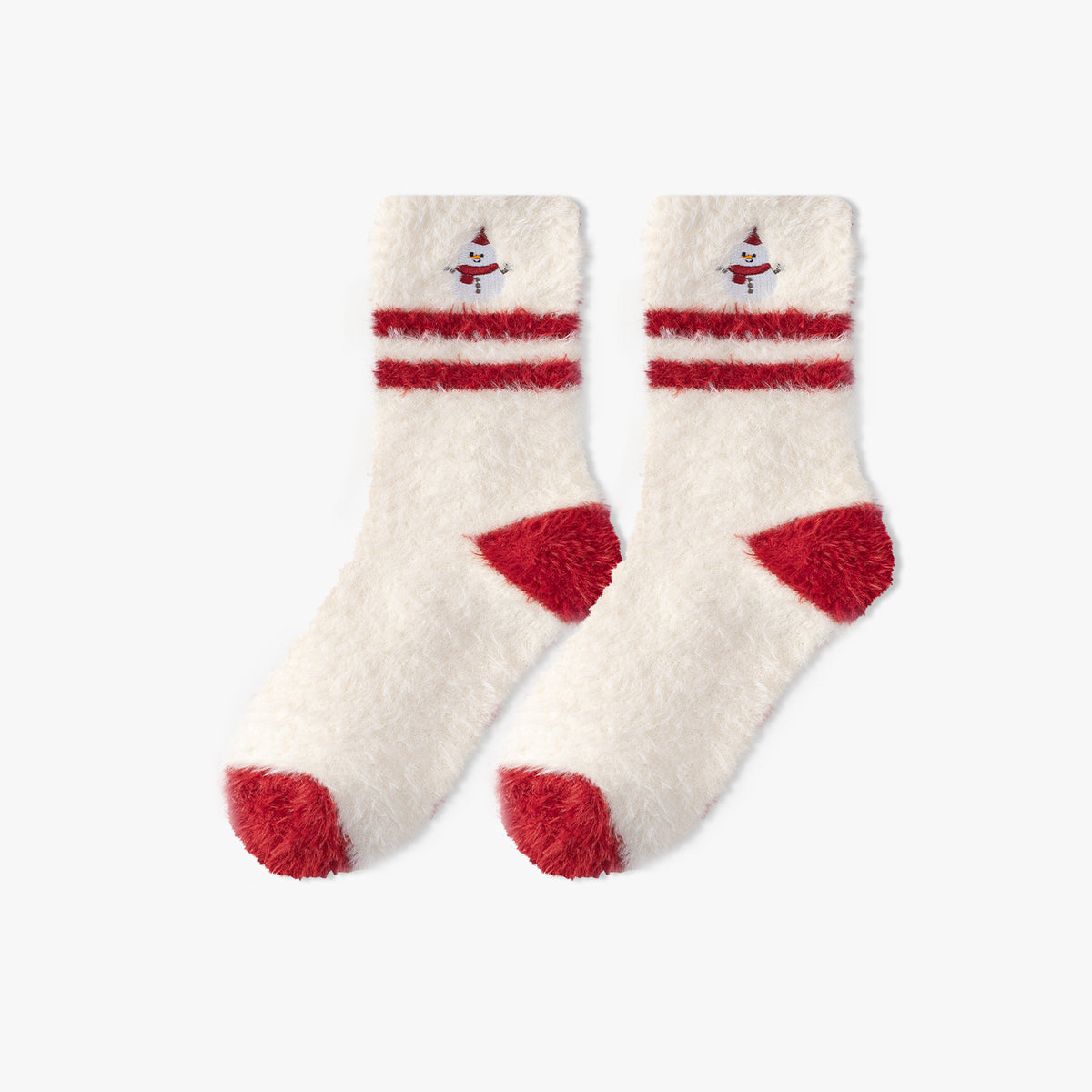Warm Christmas socks in cream plush fleece with red-striped cuffs and heels, flat-lay pair.