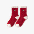 Warm Christmas socks in red plush fleece with embroidered holiday accents, shown as a flat-lay pair.