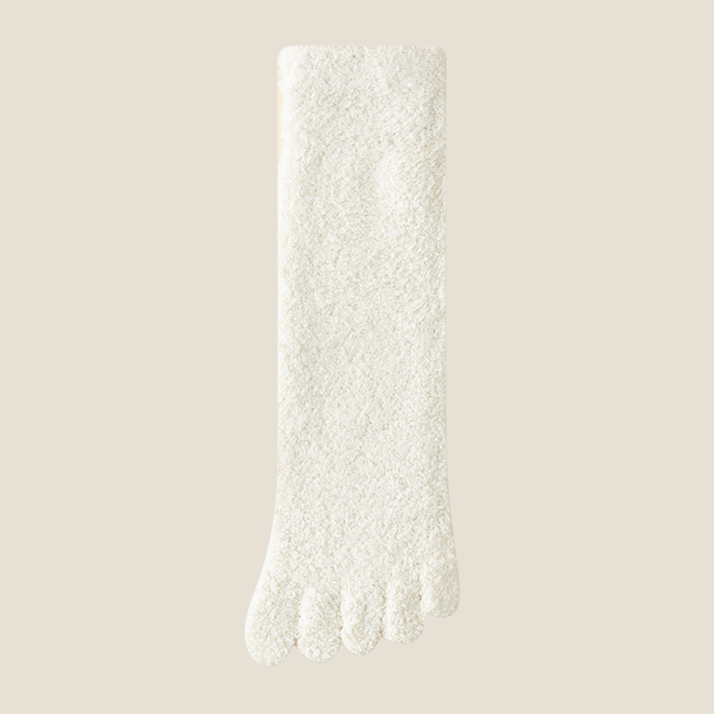 Warm toe socks in ivory plush knit, featuring a soft fuzzy surface. Shown as a single flat-lay on a neutral backdrop.