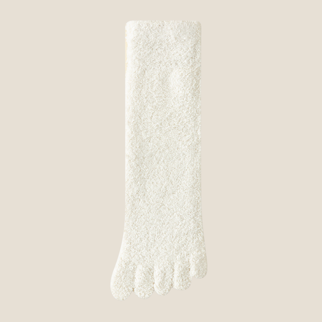 Warm toe socks in ivory plush knit, featuring a soft fuzzy surface. Shown as a single flat-lay on a neutral backdrop.