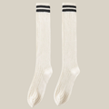 White knee socks with black stripe detail, featuring twin varsity stripes at the cuff. Shown as an upright flat-lay pair.