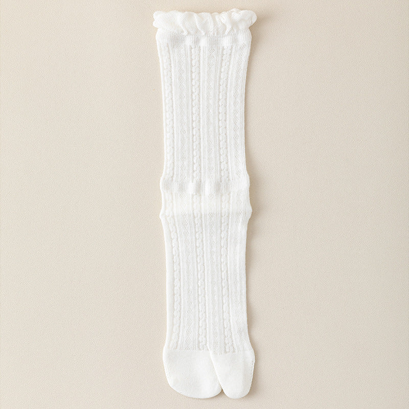 White tabi socks in crisp white, featuring a split-toe design. Shown worn to highlight the tabi shape.