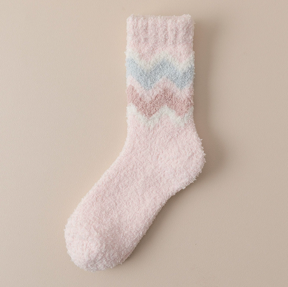 Women's fleece socks in pink with a pastel chevron stripe, single sock laid flat.