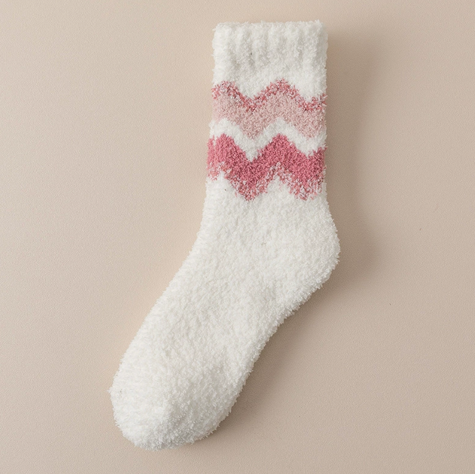 Women's fleece socks in white with a pink chevron, single sock shown flat.