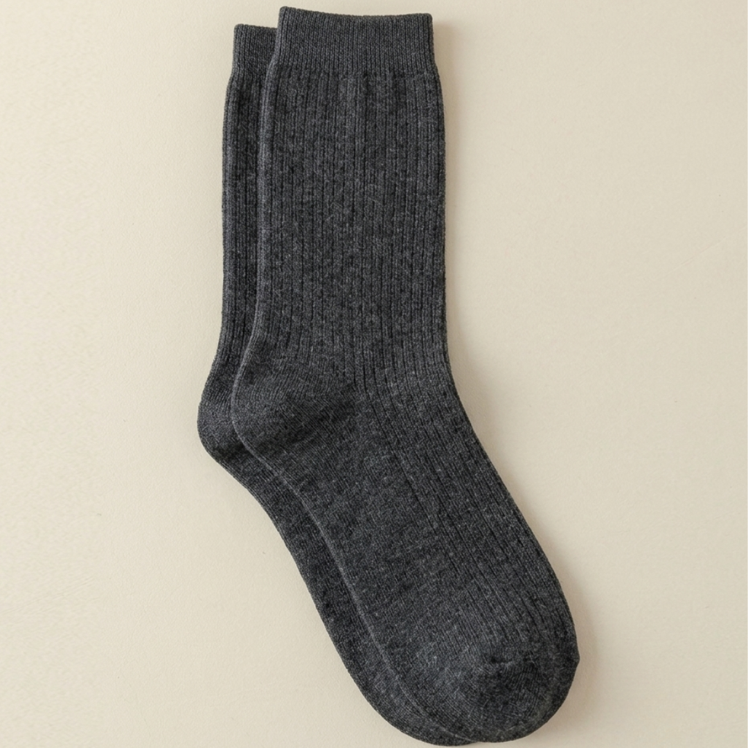 Women's boot socks in charcoal grey, featuring a soft ribbed texture. Displayed flat on a light surface.