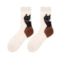 Women's cat socks in cream and coffee brown with a cartoon cat, flat-lay pair.