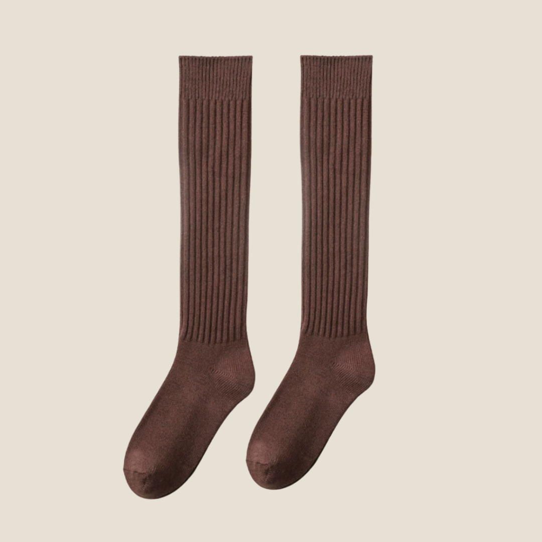 Women's high knee socks in chocolate brown ribbed knit, featuring a stretchy cuff. Shown as an upright flat-lay pair.