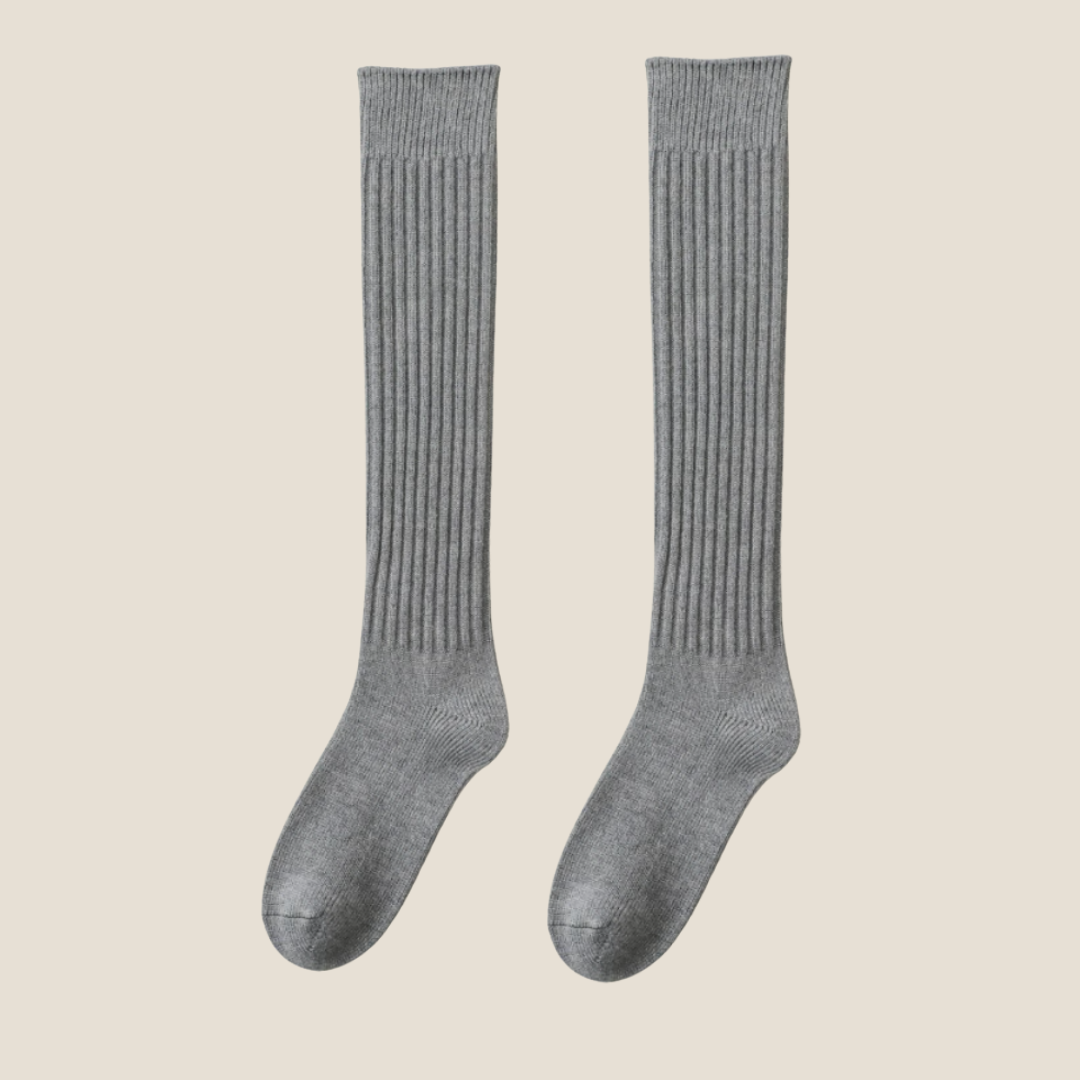 Women's high knee socks in heather grey ribbed knit, featuring a soft knee-high leg. Displayed flat as a pair on a neutral surface.