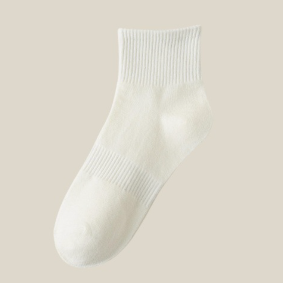 Women's quarter socks in ivory, featuring a soft ribbed body. Shown as a single flat-lay on a neutral backdrop.