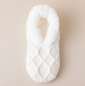 Women's slipper socks in cream diamond knit, featuring a soft sherpa cuff. Displayed flat on a light surface.