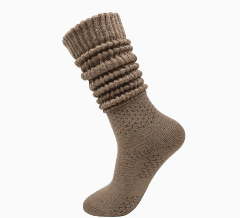 Women's slouch socks in mocha knit, featuring a bunched slouchy leg. Worn on one foot to show the drapey fit.