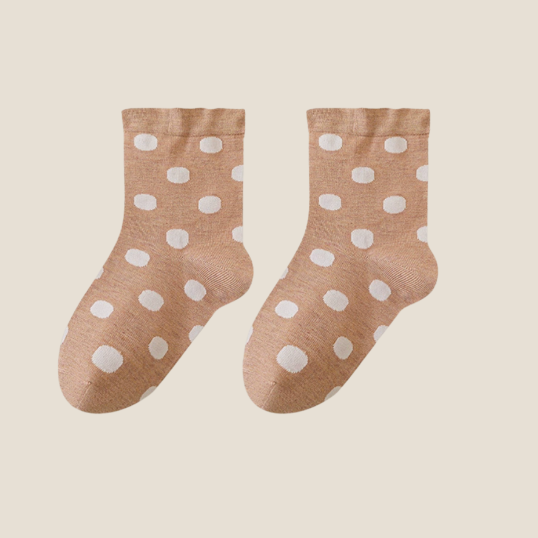 Wool bed socks in tan wool blend, featuring a cream polka-dot design. Shown flat as a pair to highlight the warm knit.