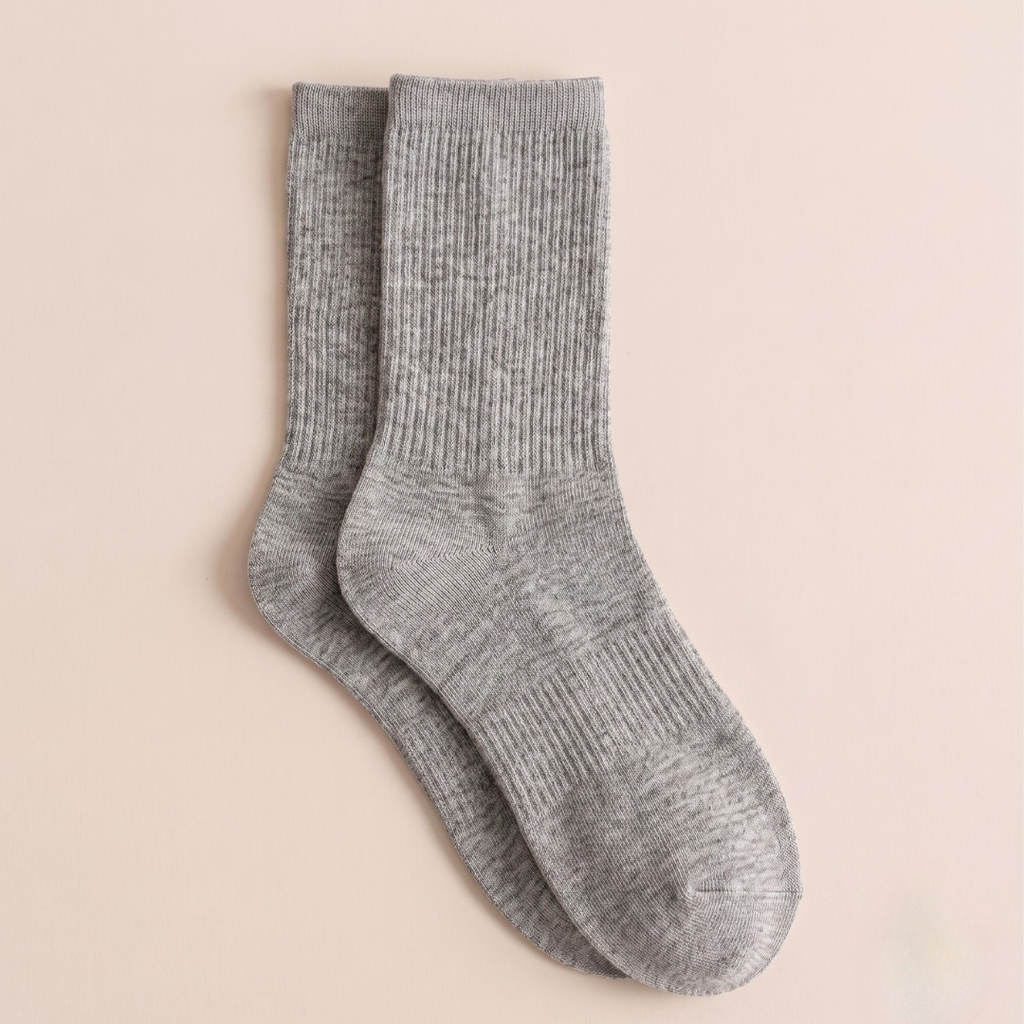 Women's wool boot socks in heather grey, featuring a soft ribbed weave. Displayed flat as a pair on a light surface.
