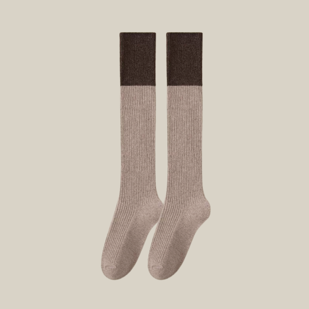 Wool knee socks in beige with a contrasting brown cuff, featuring a color-block ribbed knit. Shown as an upright flat-lay pair.