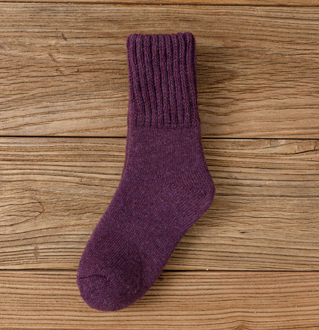Wool thick socks in plum purple, featuring a soft ribbed texture. Shown worn on foot for a cozy fit.