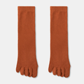 Wool toe socks in rust orange ribbed knit, featuring individual toe pockets. Shown as a flat-lay pair on a neutral backdrop.